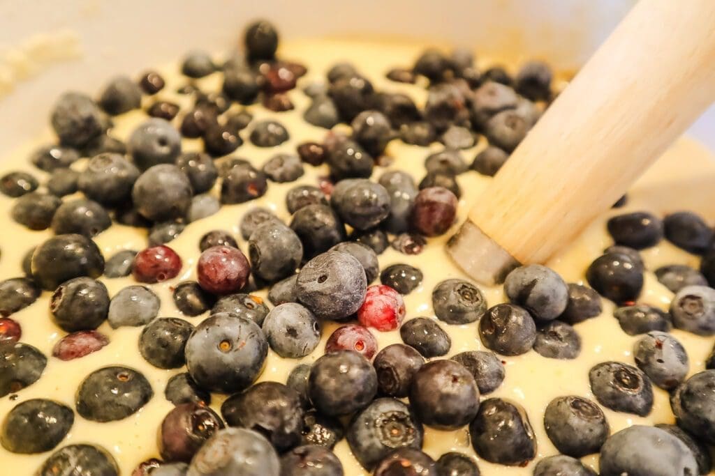 Blueberries in sourdough discard pancake batter