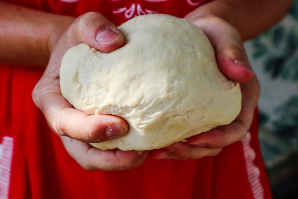 Easy Homemade PIzza pizza dough in hands