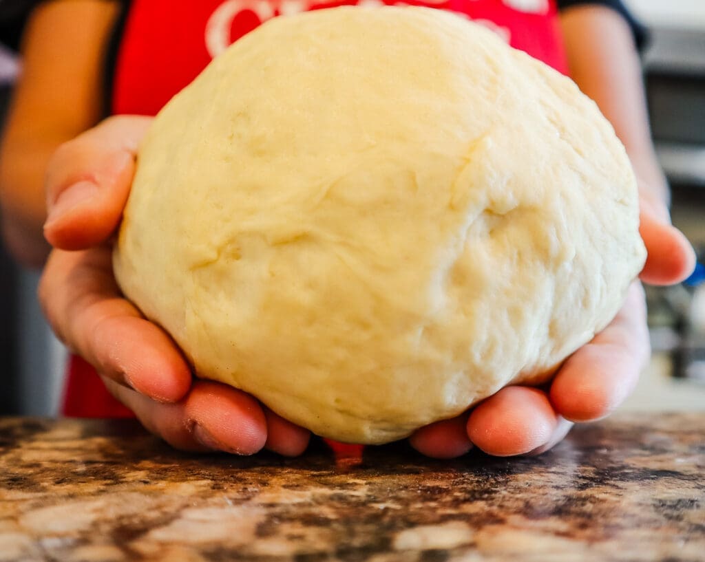 easy homemade pizza dough in hands