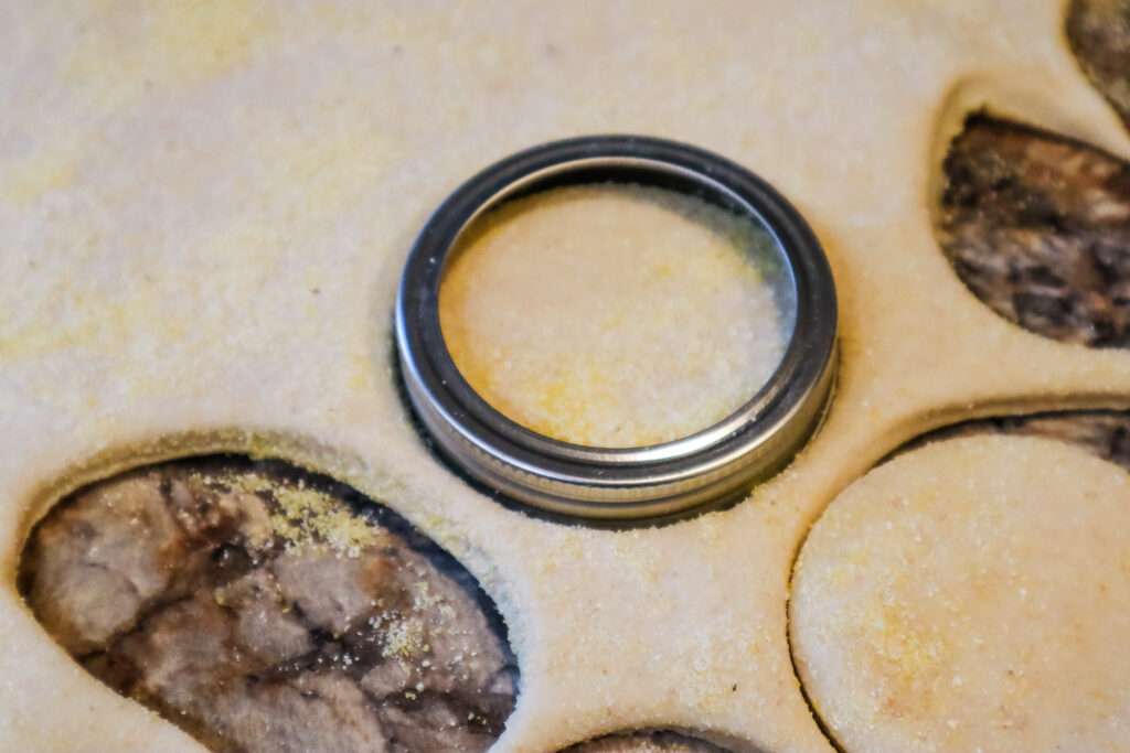 mason jar top cutting sourdough english muffins rolled out dough