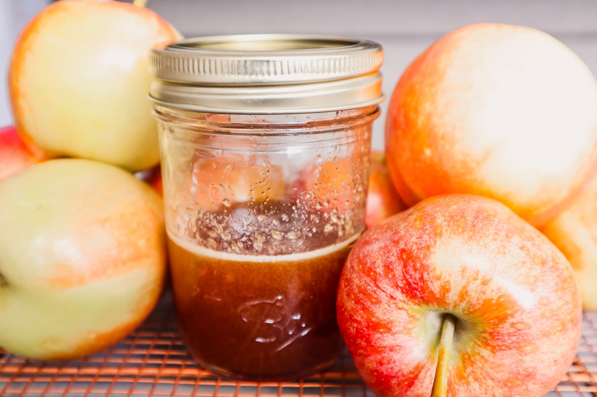 Apple Crisp Macchiato syrup in mason jar with apples