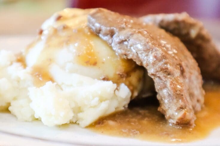 venison cube steak with gravy on mashed potatoes