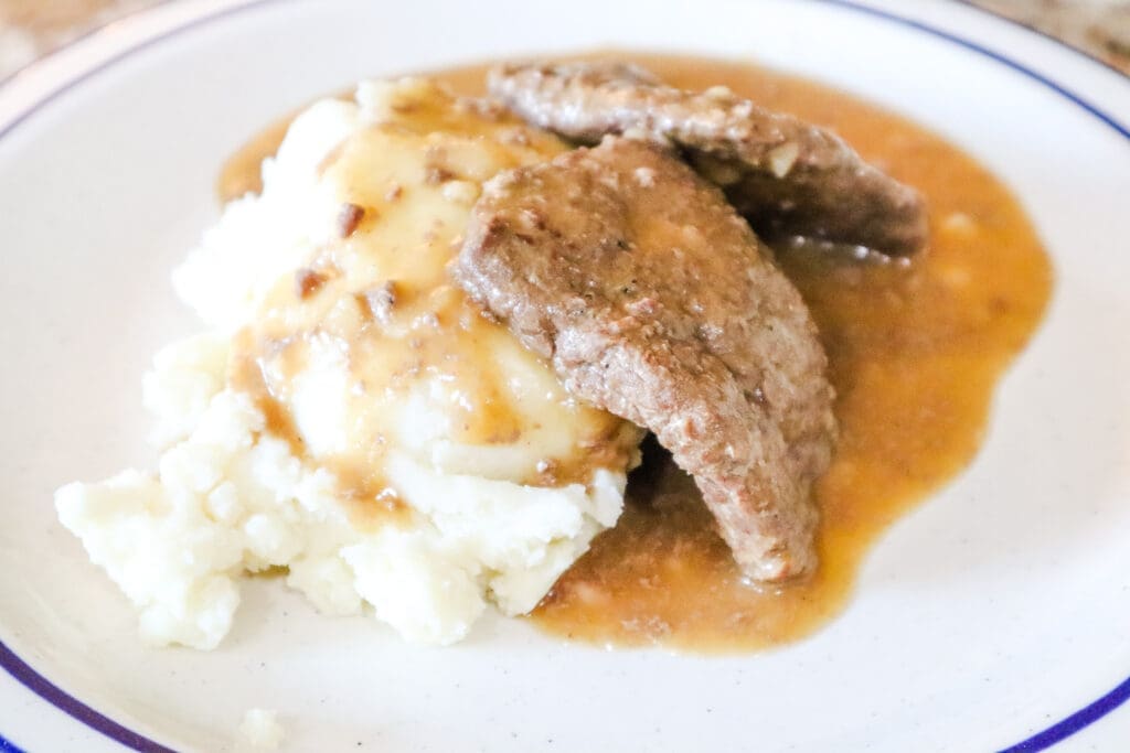 Venison cube steaks with gravy over mashed potatoes