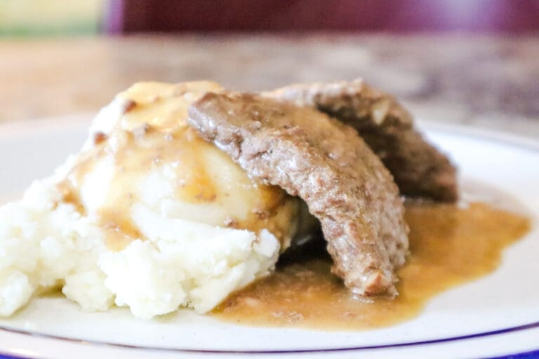 Venison cube steak with gravy over mashed potatoes